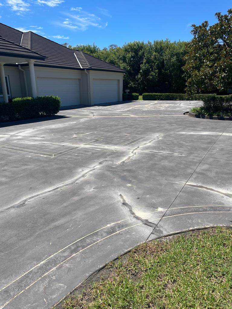 Damaged driveway before