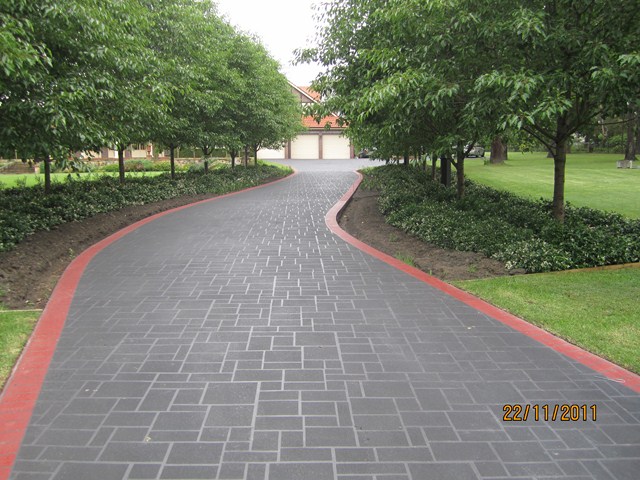 Resurfaced driveway with tile borders Dural after
