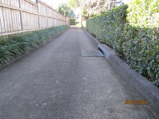 Old ugly pebblecrete driveway before